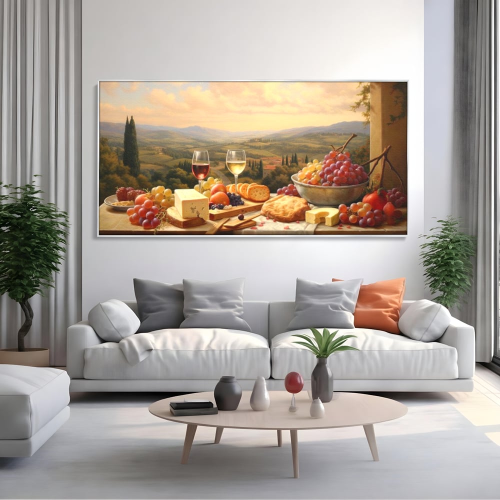 Tablou canvas cu tablou canvas cu peisaj tomnatic si masa imbelsugata, in rama de aluminiu argintiu, pe perete intr-un living